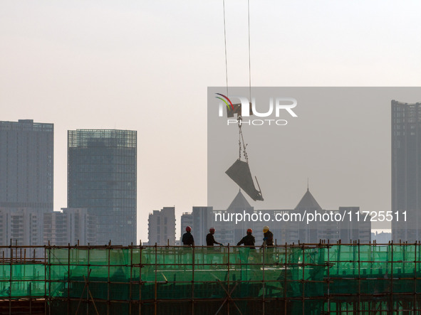 A building under construction by China Overseas Property is for sale in Qingjiangpu district, Huai 'an city, Jiangsu province, on October 31...