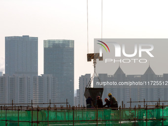 A building under construction by China Overseas Property is for sale in Qingjiangpu district, Huai 'an city, Jiangsu province, on October 31...