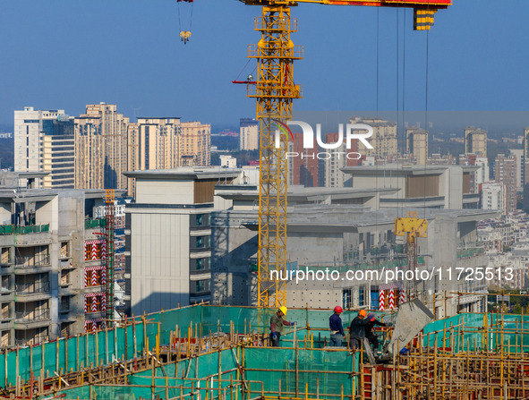 A building under construction by China Overseas Property is for sale in Qingjiangpu district, Huai 'an city, Jiangsu province, on October 31...