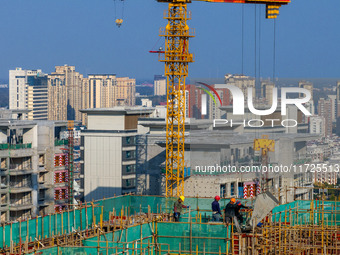 A building under construction by China Overseas Property is for sale in Qingjiangpu district, Huai 'an city, Jiangsu province, on October 31...