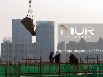 A building under construction by China Overseas Property is for sale in Qingjiangpu district, Huai 'an city, Jiangsu province, on October 31...