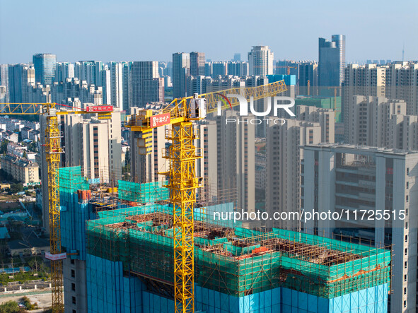 A building under construction by China Overseas Property is for sale in Qingjiangpu district, Huai 'an city, Jiangsu province, on October 31...