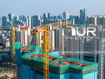 A building under construction by China Overseas Property is for sale in Qingjiangpu district, Huai 'an city, Jiangsu province, on October 31...