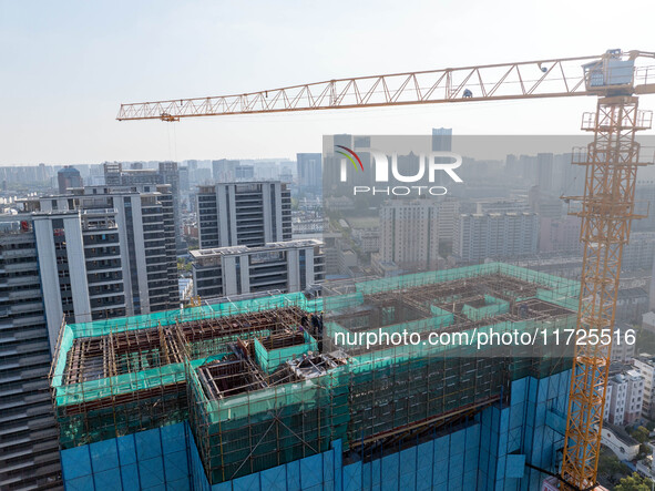 A building under construction by China Overseas Property is for sale in Qingjiangpu district, Huai 'an city, Jiangsu province, on October 31...