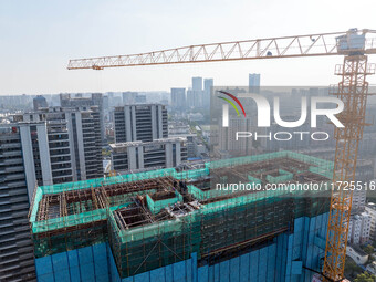 A building under construction by China Overseas Property is for sale in Qingjiangpu district, Huai 'an city, Jiangsu province, on October 31...