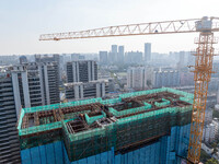 A building under construction by China Overseas Property is for sale in Qingjiangpu district, Huai 'an city, Jiangsu province, on October 31...