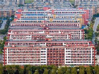 An aerial photo shows solar PV on the roof of the dormitory building of Jiangsu Agricultural and Animal Husbandry Technical College in Taizh...