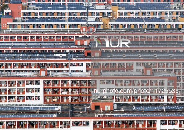 An aerial photo shows solar PV on the roof of the dormitory building of Jiangsu Agricultural and Animal Husbandry Technical College in Taizh...