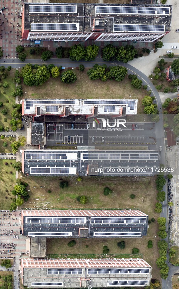 An aerial photo shows solar PV on the roof of the dormitory building of Jiangsu Agricultural and Animal Husbandry Technical College in Taizh...