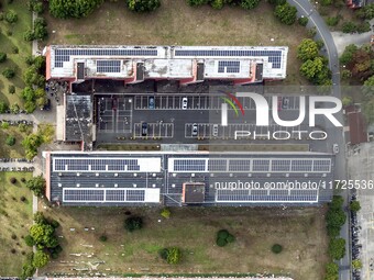 An aerial photo shows solar PV on the roof of the dormitory building of Jiangsu Agricultural and Animal Husbandry Technical College in Taizh...