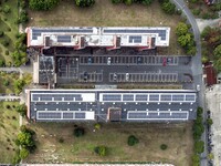 An aerial photo shows solar PV on the roof of the dormitory building of Jiangsu Agricultural and Animal Husbandry Technical College in Taizh...