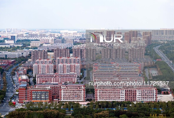 An aerial photo shows solar PV on the roof of the dormitory building of Jiangsu Agricultural and Animal Husbandry Technical College in Taizh...