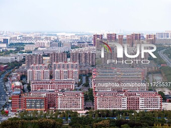 An aerial photo shows solar PV on the roof of the dormitory building of Jiangsu Agricultural and Animal Husbandry Technical College in Taizh...