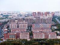 An aerial photo shows solar PV on the roof of the dormitory building of Jiangsu Agricultural and Animal Husbandry Technical College in Taizh...