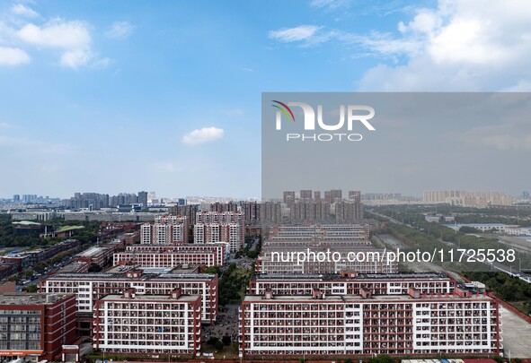 An aerial photo shows solar PV on the roof of the dormitory building of Jiangsu Agricultural and Animal Husbandry Technical College in Taizh...