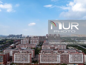 An aerial photo shows solar PV on the roof of the dormitory building of Jiangsu Agricultural and Animal Husbandry Technical College in Taizh...