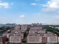 An aerial photo shows solar PV on the roof of the dormitory building of Jiangsu Agricultural and Animal Husbandry Technical College in Taizh...