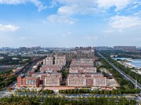 An aerial photo shows solar PV on the roof of the dormitory building of Jiangsu Agricultural and Animal Husbandry Technical College in Taizh...