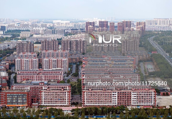 An aerial photo shows solar PV on the roof of the dormitory building of Jiangsu Agricultural and Animal Husbandry Technical College in Taizh...