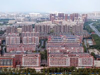 An aerial photo shows solar PV on the roof of the dormitory building of Jiangsu Agricultural and Animal Husbandry Technical College in Taizh...