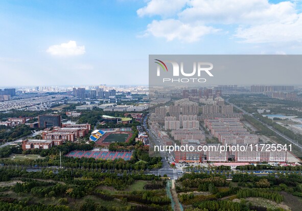 An aerial photo shows solar PV on the roof of the dormitory building of Jiangsu Agricultural and Animal Husbandry Technical College in Taizh...