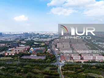 An aerial photo shows solar PV on the roof of the dormitory building of Jiangsu Agricultural and Animal Husbandry Technical College in Taizh...