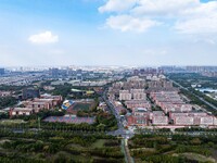 An aerial photo shows solar PV on the roof of the dormitory building of Jiangsu Agricultural and Animal Husbandry Technical College in Taizh...