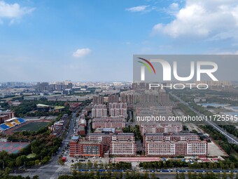 An aerial photo shows solar PV on the roof of the dormitory building of Jiangsu Agricultural and Animal Husbandry Technical College in Taizh...