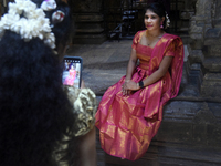 Hindu devotees take pictures in the Hindu temple in Colombo, Sri Lanka, on October 31, 2024. Deepavali, also known as Diwali, is a vibrant f...