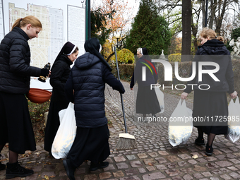 Nuns walk at the Rakowicki Cemetery a day ahead of the All Saints Day in Krakow, Poland on October 31, 2024. (