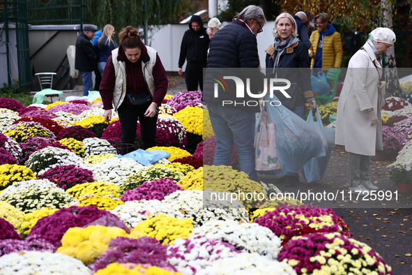 People do shopping at the stand near the Rakowicki Cemetery a day ahead of the All Saints Day in Krakow, Poland on October 31, 2024. 