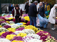 People do shopping at the stand near the Rakowicki Cemetery a day ahead of the All Saints Day in Krakow, Poland on October 31, 2024. (