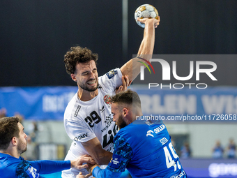 Nedim Remili and Zoltan Szita  are playing during the match EHF Champions League Men match between  Orlen Wisla Plock and Veszprem HC in Plo...