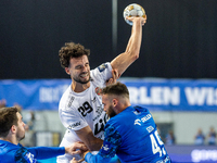 Nedim Remili and Zoltan Szita  are playing during the match EHF Champions League Men match between  Orlen Wisla Plock and Veszprem HC in Plo...