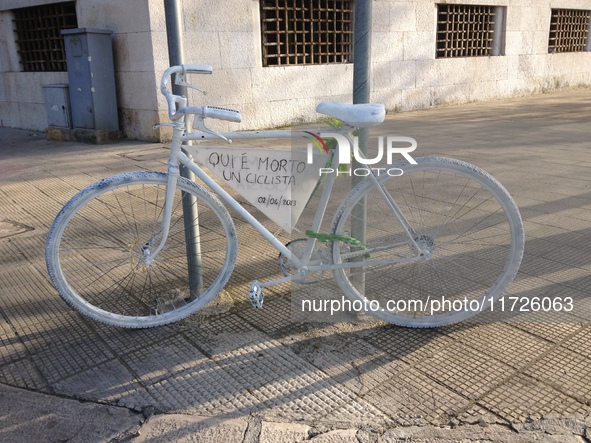 A white-painted ghost bike tied to a pole in Bari, Italy, on April 2, 2013, commemorates the tragic death of a cyclist struck by a car. It b...