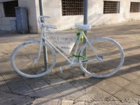 A white-painted ghost bike tied to a pole in Bari, Italy, on April 2, 2013, commemorates the tragic death of a cyclist struck by a car. It b...