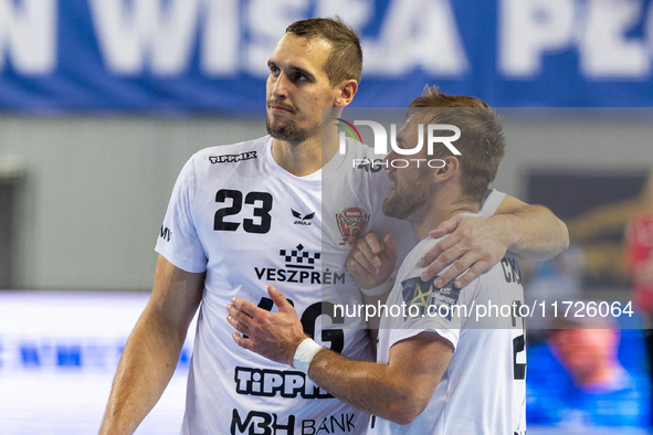 Patrik Ligetvari and Luka Cindric are playing during the match EHF Champions League Men match between  Orlen Wisla Plock and Veszprem HC in...