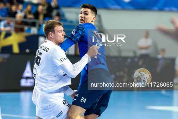 Dragan Pechmalbec and Gergo Fazekas are playing during the match EHF Champions League Men match between  Orlen Wisla Plock and Veszprem HC i...