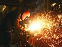 A construction worker builds petrochemical equipment at Lanshi Heavy Machinery Co LTD in Qingdao, China, on October 31, 2024. (