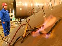 A construction worker builds petrochemical equipment at Lanshi Heavy Machinery Co LTD in Qingdao, China, on October 31, 2024. (