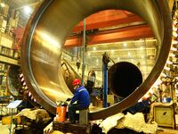 A construction worker builds petrochemical equipment at Lanshi Heavy Machinery Co LTD in Qingdao, China, on October 31, 2024. (