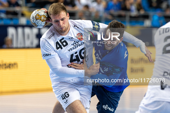 Dragan Pechmalbec and Miha Zarabec  are playing during the match EHF Champions League Men match between  Orlen Wisla Plock and Veszprem HC i...