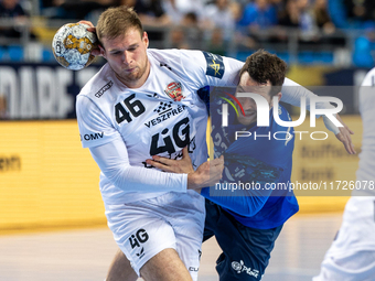 Dragan Pechmalbec and Miha Zarabec  are playing during the match EHF Champions League Men match between  Orlen Wisla Plock and Veszprem HC i...