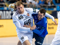 Dragan Pechmalbec and Miha Zarabec  are playing during the match EHF Champions League Men match between  Orlen Wisla Plock and Veszprem HC i...