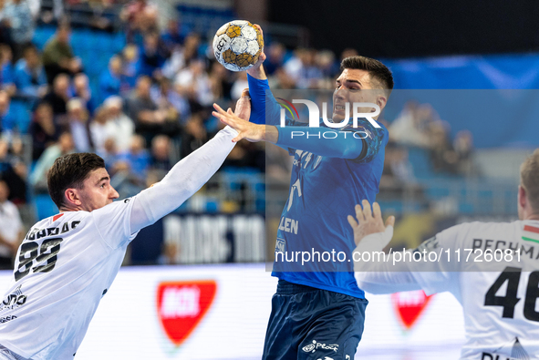 Ludovic Fabregas and Gergo Fazekas are playing during the match EHF Champions League Men match between  Orlen Wisla Plock and Veszprem HC in...