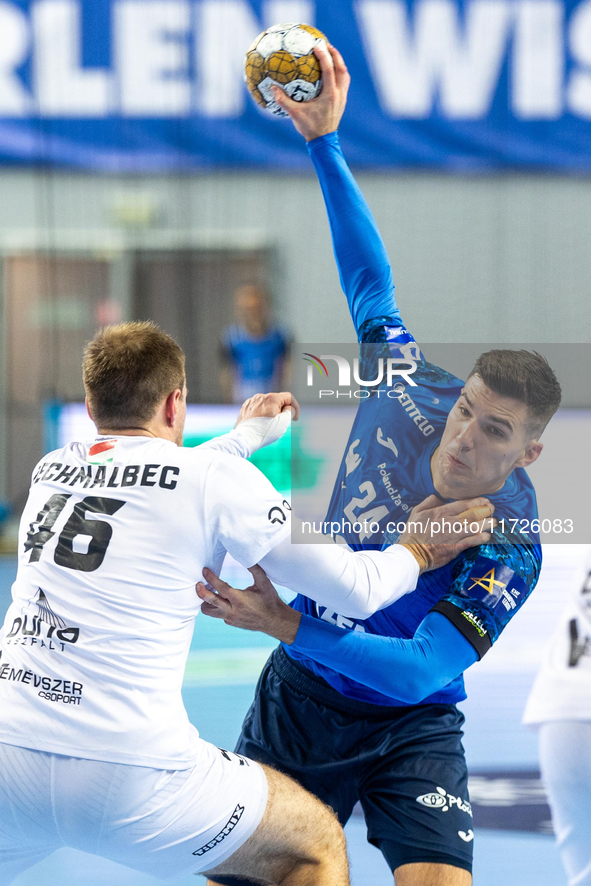 Dragan Pechmalbec and Gergo Fazekas are playing during the match EHF Champions League Men match between  Orlen Wisla Plock and Veszprem HC i...