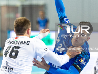 Dragan Pechmalbec and Gergo Fazekas are playing during the match EHF Champions League Men match between  Orlen Wisla Plock and Veszprem HC i...