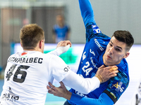 Dragan Pechmalbec and Gergo Fazekas are playing during the match EHF Champions League Men match between  Orlen Wisla Plock and Veszprem HC i...