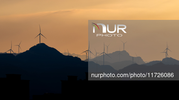 A wind power plant operates at Liangfengya in the Nanchuan district of Chongqing, China, on October 30, 2024. 