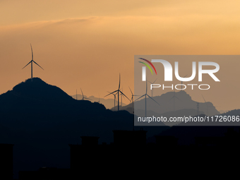 A wind power plant operates at Liangfengya in the Nanchuan district of Chongqing, China, on October 30, 2024. (